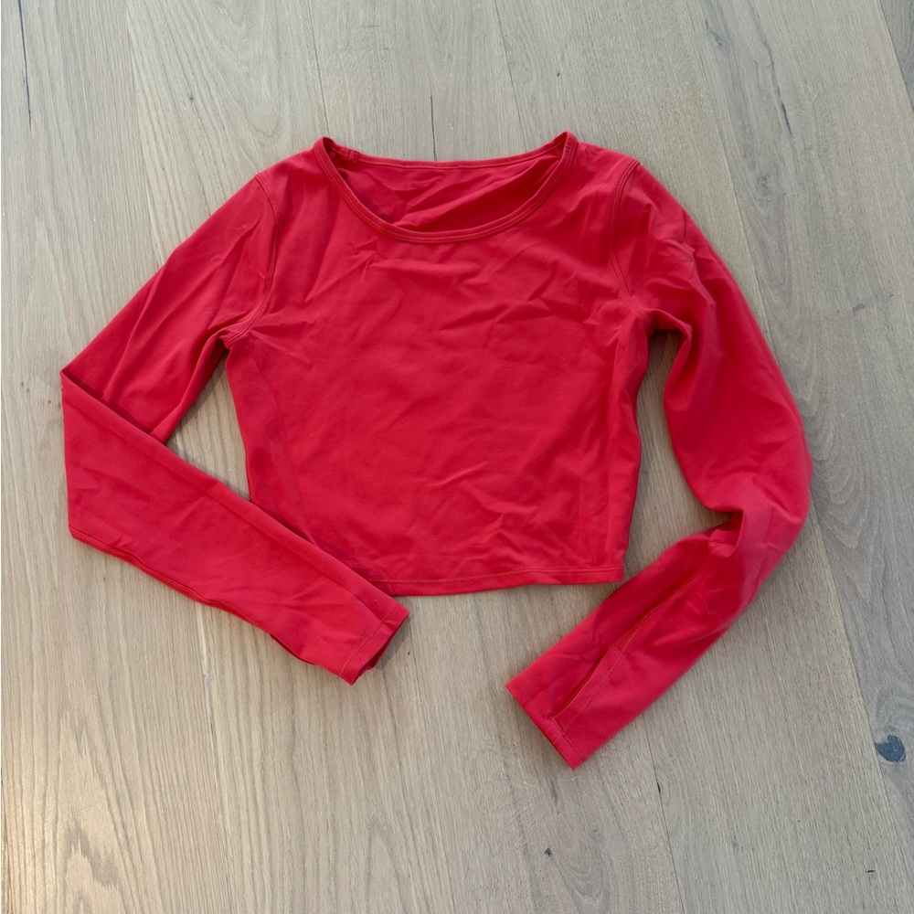Lululemon wunder train long sleeve crop top size 6 pink coral workout top